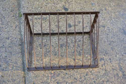 An iron wall-mounted hay rack. 75cms wide