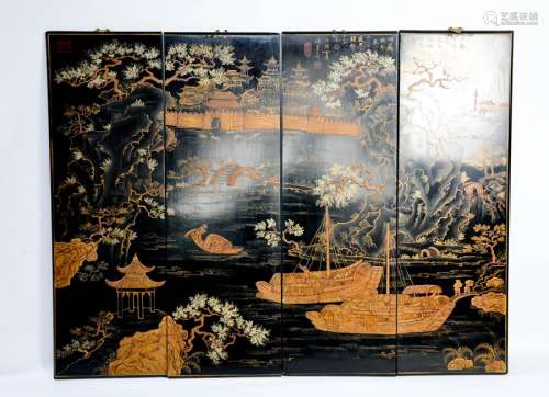 A set of four late 19th century black lacquered Chinese panels, depicting junks and town scenes