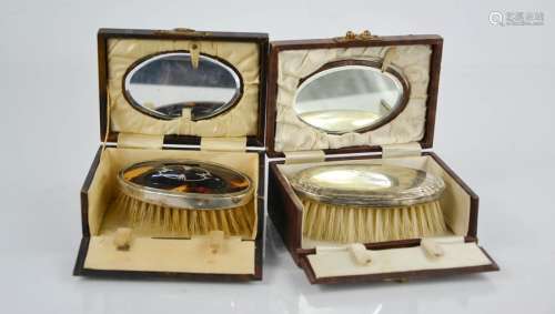 Two 19th century silver brush and mirror travelling sets in original box , one tortoiseshell and