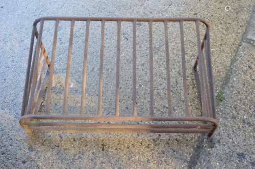A large iron wall mounted hay rack. 106cms wide