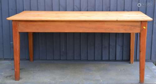 A pine kitchen table with square tapered legs, 77cm by 167 by 86cm.