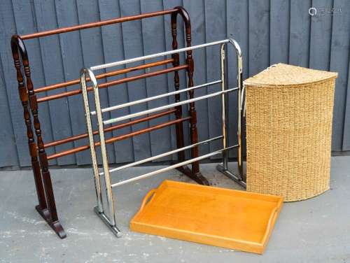 A chrome towel rail, a wicker linen basket, a wooden rail and a tray.