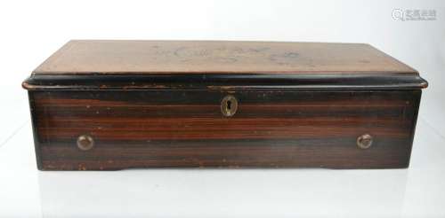 A 19th century Swiss musical box, inlaid to the top with floral inlay, 56 by 21cm.