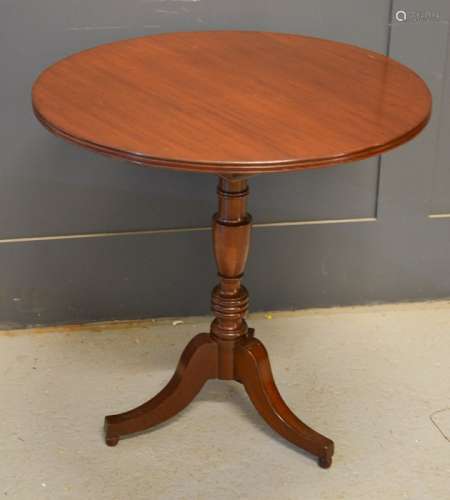 A mahogany occasional tilt-top table, with tripod base.