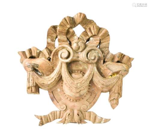 A French 19th century oak section of carving, composed of bows and swags surrounding shield form