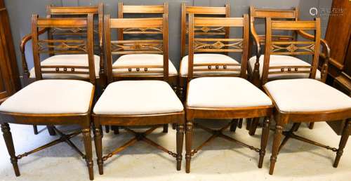 A set of eight Regency mahogany dining chairs, with grey upholstered drop in seats.
