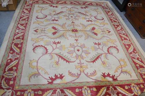 A large Turkish rug, cream ground, 330cm by 280cm