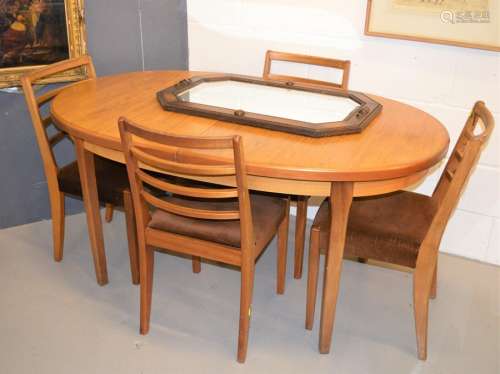 A dining table, chairs and a mirror circa 1940.