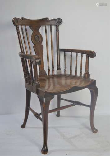 A 19th century oak kitchen armchair.