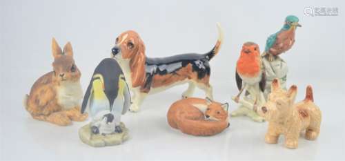 A Beswick basset hound together with a group of ceramic animals to include Goebel and Sylvac