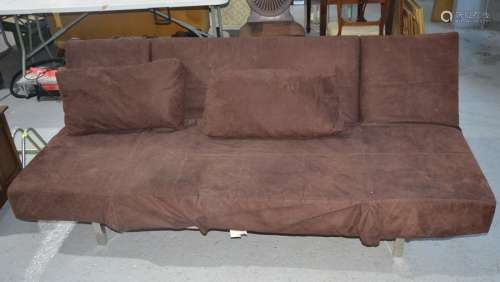 A brown suede sofa bed on a chrome base with a ratcheted movement