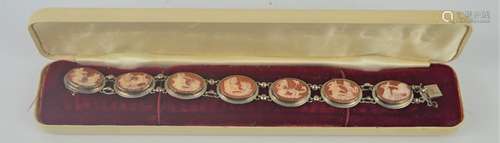 A silver cameo bracelet.