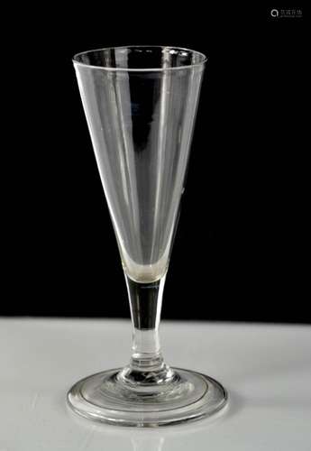 A Georgian fluted glass, with short stem, raised pontil to the base, 15cm high.