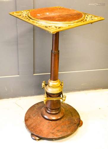 A 19th century mahogany and brass jardiniere stand.