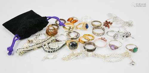 A group of rings to include silver examples, two crystal set bracelets, a ballerina pendant necklace