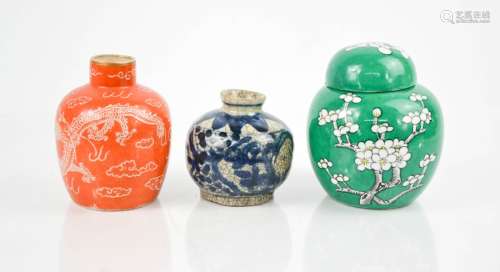Three Chinese ceramic jars, including one green ground ginger jar and one with orange ground