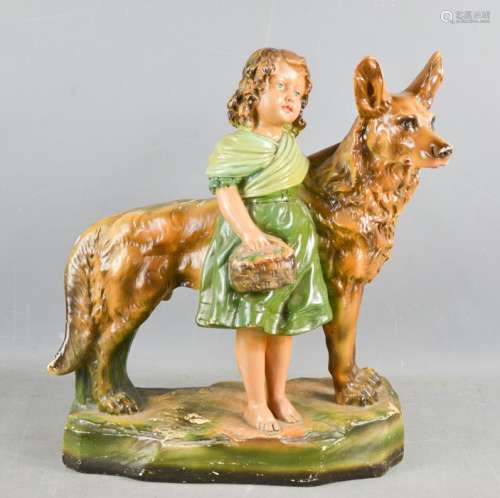 An Art Deco painted plasterwork model German Shepherd and girl.