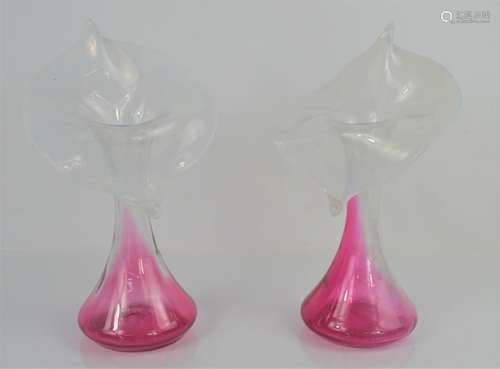 A pair of cranberry glass and vaseline glass bud vases. 22.5cm high