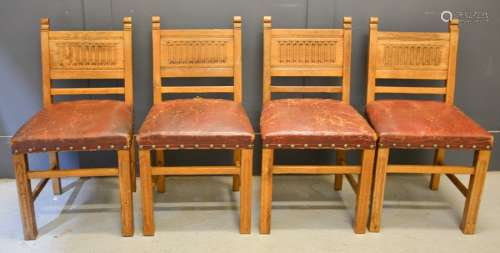 Four 17th century style oak chairs with nulled back panels and red leather seats