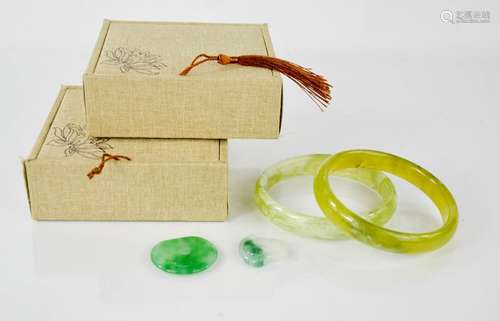 Two Jade bangles in boxes together with two Jade pendants one in the style of a Buddha - bangle