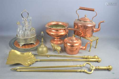 A group of brass fire irons and a quantity of copper.