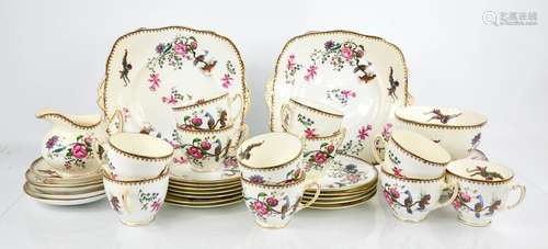 A Paragon china part tea service, comprising milk jug, cups and saucers, cake plates, slop bowl, and