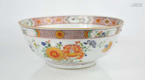 A 19th century Chinese enamelled bowl, depicting floral groups, and having an inner and outer
