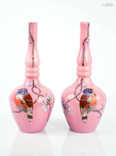 A pair of pink glass bohemian vases, hand painted with birds, 26cm high.