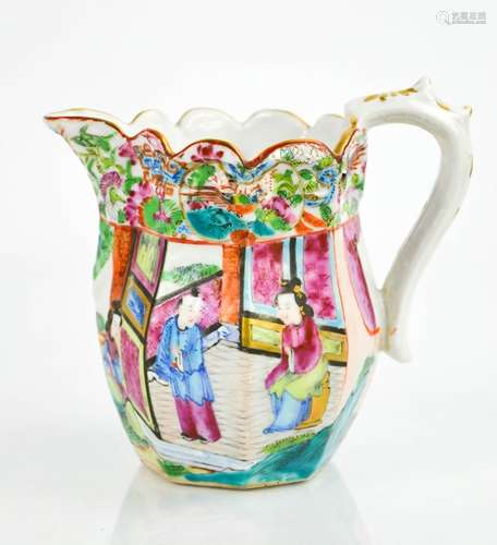 A Chinese Famille Rose jug, painted with figures in a garden, the scalloped and embossed rim painted