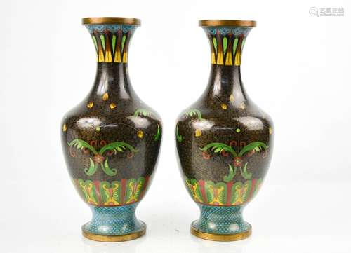 A pair of black ground cloisonne baluster vases, with turquoise base and polychrome stylised foliate