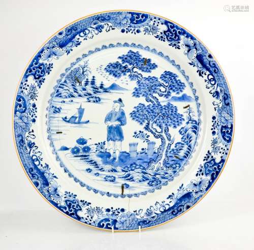 A large Chinese blue and white 19th century charger, depicting figure in landscape. A/F