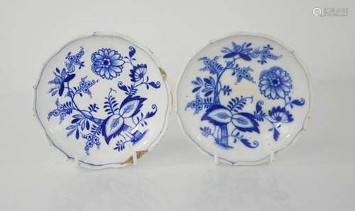 A pair of blue and white EWM&Co Meissen dishes depicting flowers, 14cm diameter. A/F