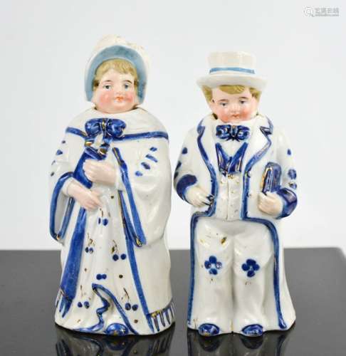 A pair of vintage ceramic bobble head nodder figures. 16cms tall