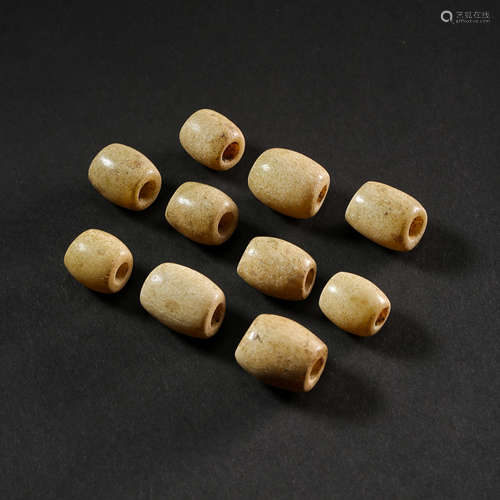 A GROUP OF CHINESE HETIAN JADE BEADS