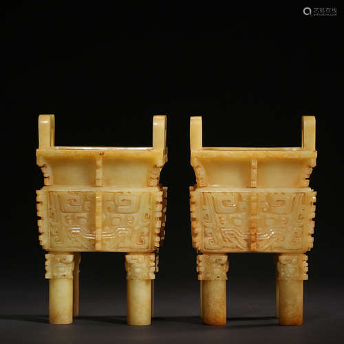 A PAIR OF CHINESE HAN DYNASTY HETIAN JADE DINGS