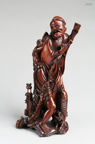 A Carved Wooden Figurine