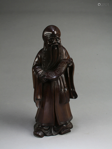 A Carved Hardwood Figurine