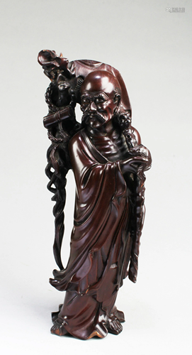 A Carved Wooden Figurine