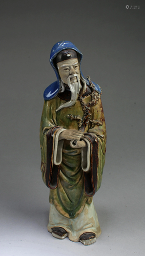 A Porcelain Deity Statue