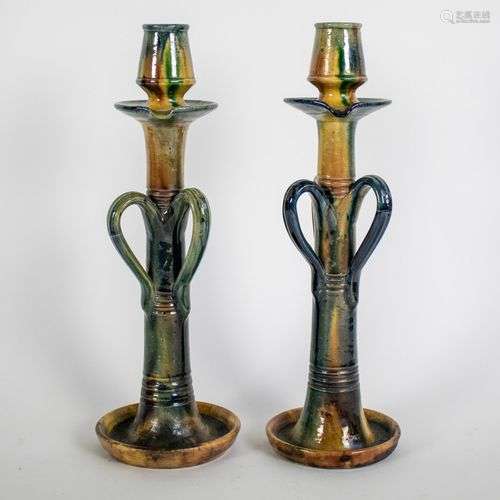 A pair of Flemish earthware candlesticks