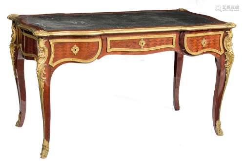 A rosewood veneered Louis XV style 'bureau plat', decorated with parquetry, gilt bronze mounts and l