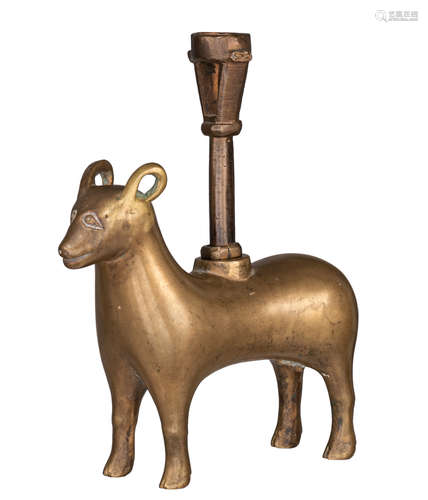 A medieval bronze zoomorphic candleholder, shaped like a goat, with on top a Gothic candlestick, pro