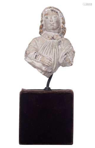 A white limestone fragment of an angel, with traces of polychrome paint, 15th/16thC, France, mounted