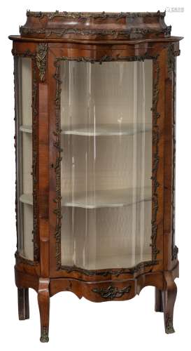 A fine mahogany veneered Rococo style display cabinet, decorated with bronze mounts and the inside w