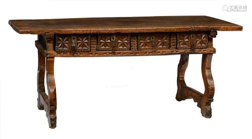 An impressive Spanish Baroque walnut trestle table, decorated with a four-drawer frieze with carved