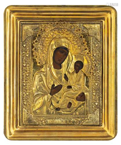 An Eastern European icon depicting the Holy Mother and Child with a gilt oklad, 17 x 21 cm (the okla