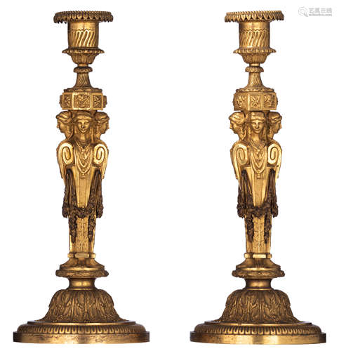 A fine pair of ormolu bronze Louis XVI style candlesticks, decorated with satyr masks, guirlandes, r