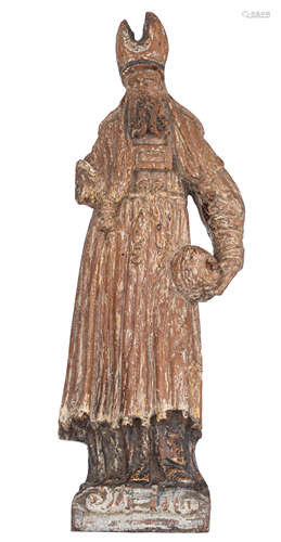 An oak sculpture of a saint, with traces of polychrome paint, 17thC, H 39 cm