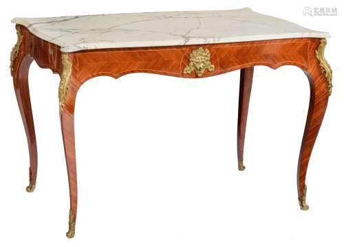 A fine mahogany veneered Louis XV style centre table, decorated with gilt bronze mounts and on top a