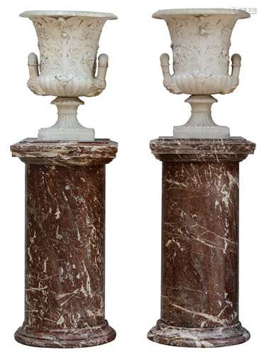 A very finely sculpted pair of Carrara marble Medici vases, abundantly decorated with acanthus leave